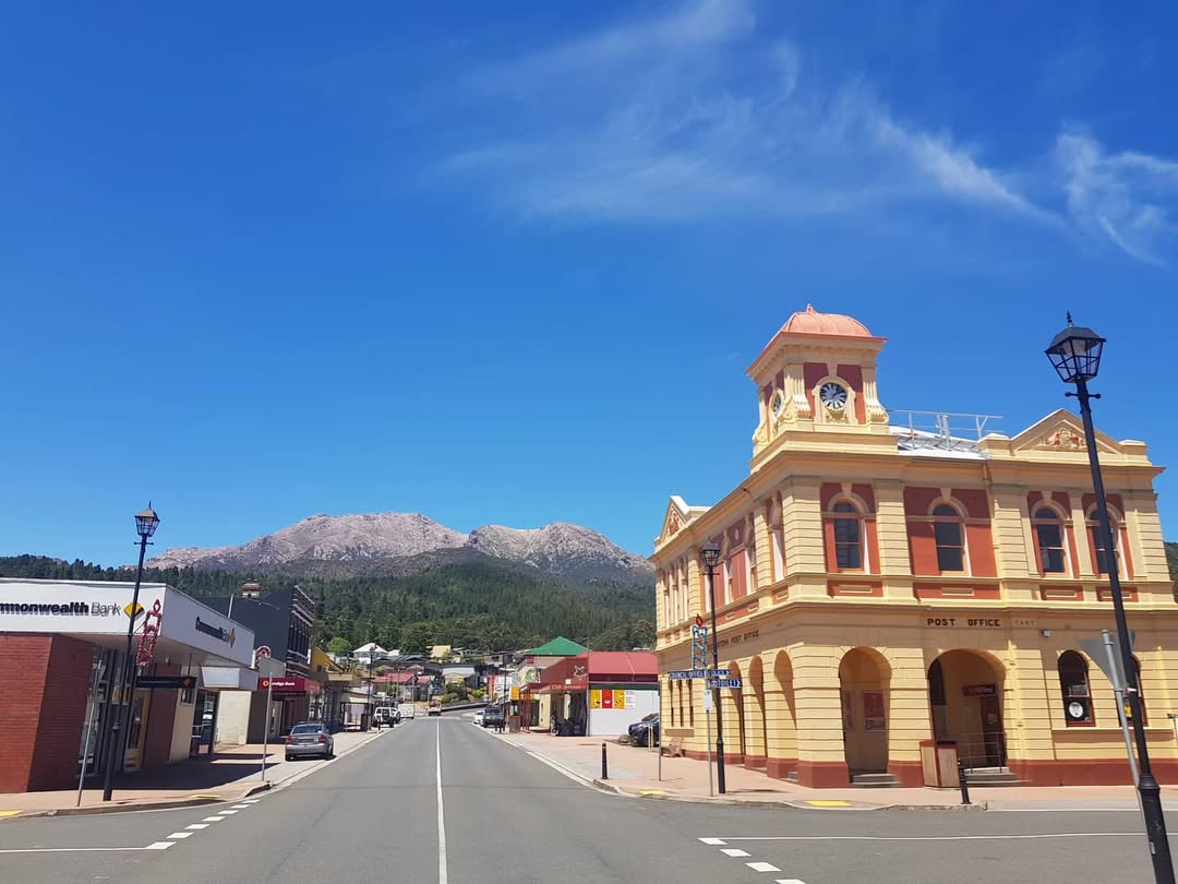 Queenstown Tasmania with a prominent building and mountain in the background